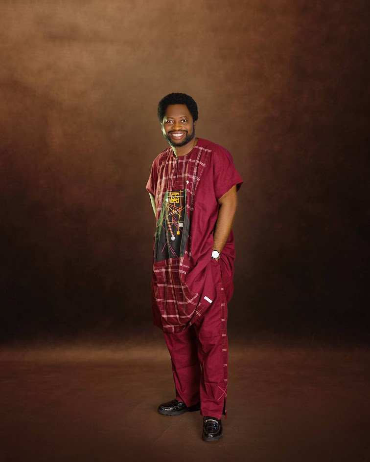 Ayo Oke in a maroon traditional agbada